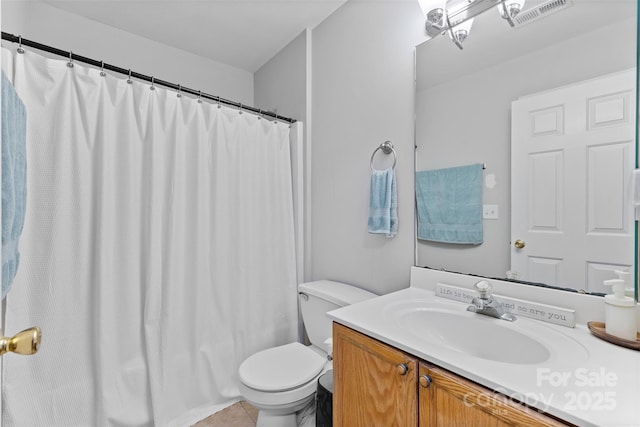 9637 Brookmere Ln, Charlotte, NC 28214 - bathroom with toilet, vanity, and tile patterned flooring