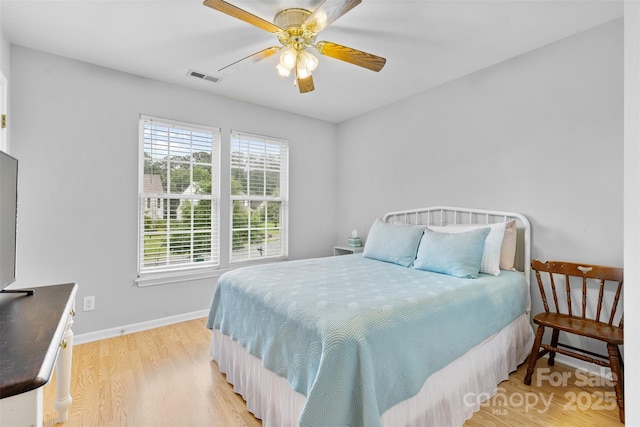 9637 Brookmere Ln, Charlotte, NC 28214 - bedroom featuring light wood-style floors, baseboards, and a ceiling fan