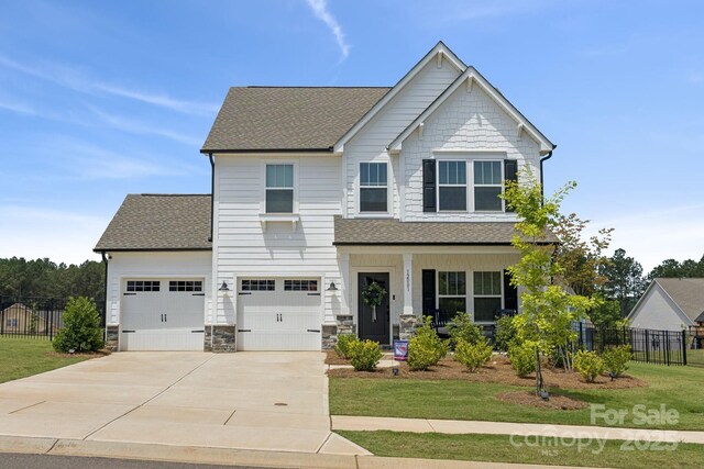 12001 Sam Snead Ct, Lancaster, SC 29720 - craftsman inspired home with concrete driveway, roof with shingles, covered porch, and stone siding