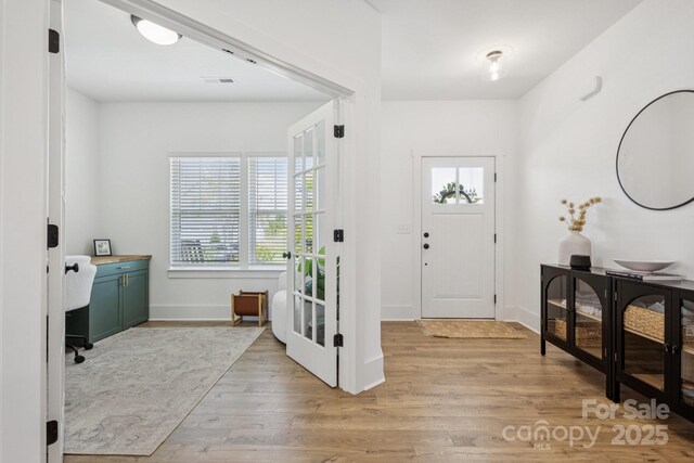 12001 Sam Snead Ct, Lancaster, SC 29720 - foyer entrance featuring light wood-type flooring and baseboards
