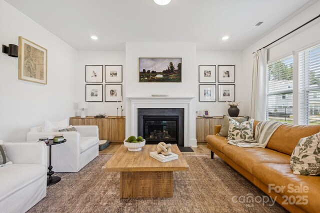 12001 Sam Snead Ct, Lancaster, SC 29720 - living area with a fireplace with flush hearth, recessed lighting, and wood finished floors