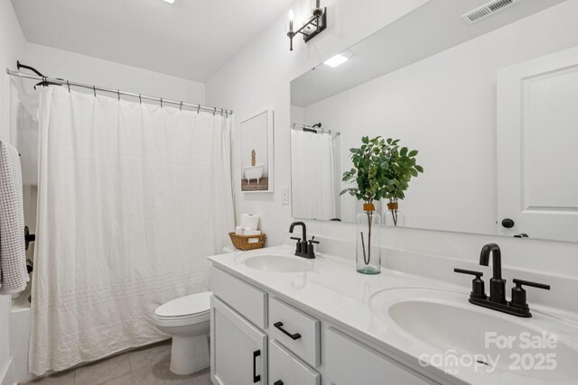 12001 Sam Snead Ct, Lancaster, SC 29720 - full bath with double vanity, tile patterned flooring, and shower / tub combo with curtain