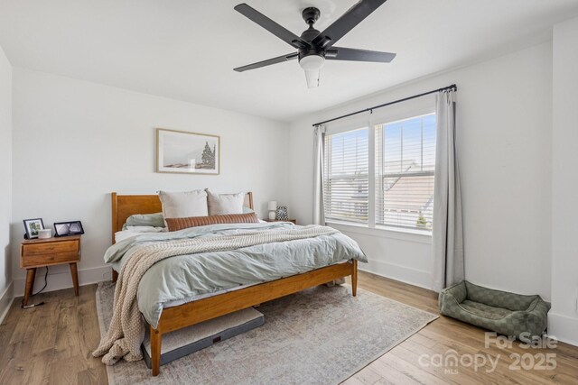 12001 Sam Snead Ct, Lancaster, SC 29720 - bedroom with wood finished floors and a ceiling fan