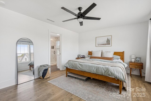 12001 Sam Snead Ct, Lancaster, SC 29720 - bedroom featuring light wood-style flooring, a ceiling fan, and connected bathroom