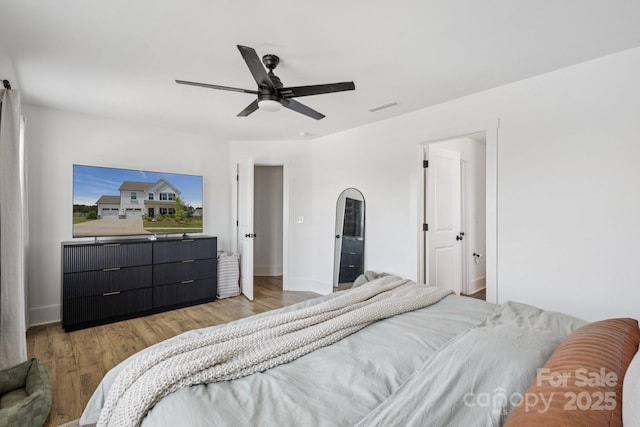 12001 Sam Snead Ct, Lancaster, SC 29720 - bedroom with light wood finished floors and ceiling fan