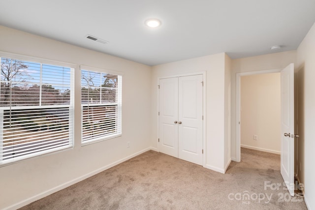 834 N Flint St, Lincolnton, NC 28092 - unfurnished bedroom with carpet floors, baseboards, and a closet