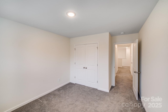 834 N Flint St, Lincolnton, NC 28092 - unfurnished bedroom featuring carpet flooring, baseboards, and a closet
