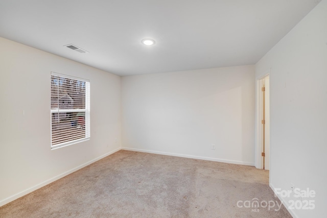 834 N Flint St, Lincolnton, NC 28092 - carpeted empty room featuring baseboards and recessed lighting