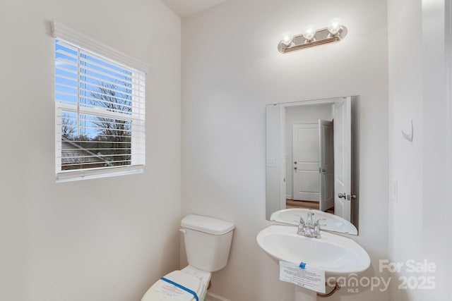 834 N Flint St, Lincolnton, NC 28092 - bathroom with toilet and a sink