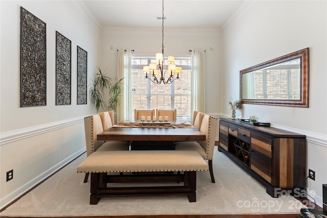 2504 River Oaks Dr, Waxhaw, NC 28173 - dining room with a chandelier, light colored carpet, and crown molding