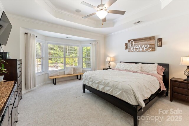 2504 River Oaks Dr, Waxhaw, NC 28173 - bedroom with light carpet, ornamental molding, a raised ceiling, and a ceiling fan