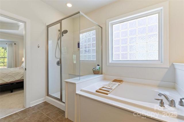 2504 River Oaks Dr, Waxhaw, NC 28173 - ensuite bathroom featuring a bath, a shower stall, ornamental molding, and tile patterned flooring