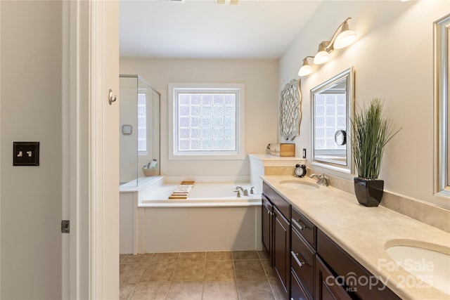 2504 River Oaks Dr, Waxhaw, NC 28173 - bathroom featuring plenty of natural light, double vanity, a bath, and a stall shower