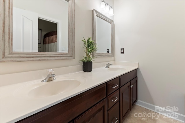 2504 River Oaks Dr, Waxhaw, NC 28173 - bathroom with double vanity and tile patterned floors