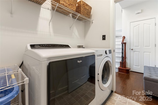 2504 River Oaks Dr, Waxhaw, NC 28173 - laundry room with washing machine and clothes dryer and light wood finished floors