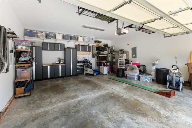 2504 River Oaks Dr, Waxhaw, NC 28173 - garage with electric panel and a garage door opener
