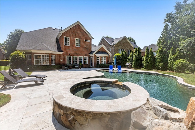 2504 River Oaks Dr, Waxhaw, NC 28173 - view of swimming pool featuring a patio area and a pool with connected hot tub
