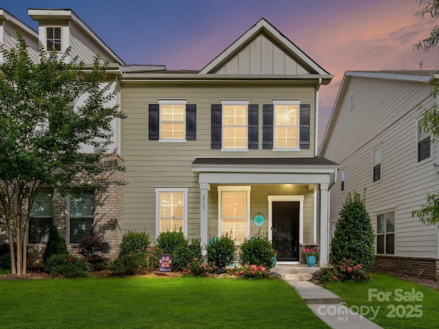 2343 Mt Harmony Church Rd, Matthews, NC 28104 - view of front of house featuring board and batten siding and a yard