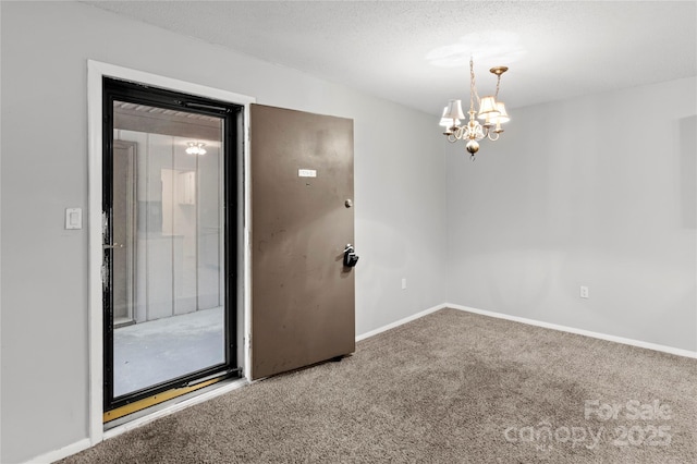 2205 Sunderland Rd Unit 129D, Winston Salem, NC 27103 - carpeted spare room with a chandelier, baseboards, and a textured ceiling