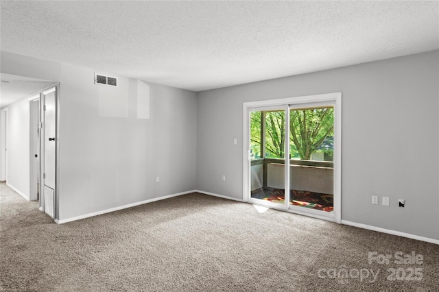 2205 Sunderland Rd Unit 129D, Winston Salem, NC 27103 - carpeted empty room with a textured ceiling and baseboards