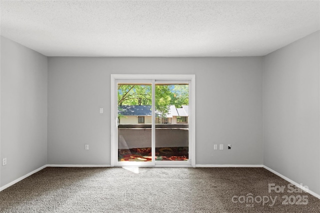 2205 Sunderland Rd Unit 129D, Winston Salem, NC 27103 - carpeted empty room with a textured ceiling and baseboards