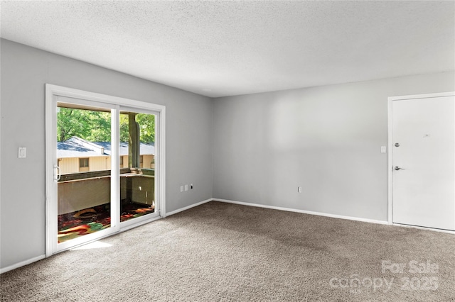 2205 Sunderland Rd Unit 129D, Winston Salem, NC 27103 - carpeted empty room featuring a textured ceiling and baseboards