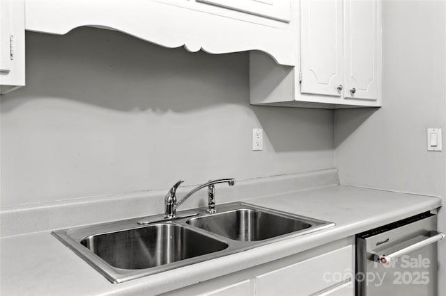 2205 Sunderland Rd Unit 129D, Winston Salem, NC 27103 - kitchen with a sink, white cabinets, dishwasher, and light countertops