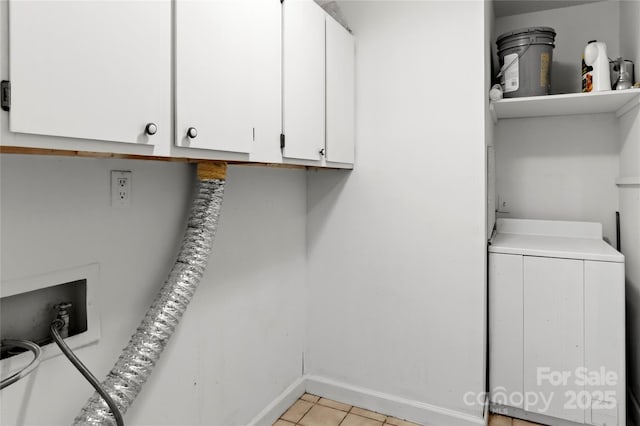 2205 Sunderland Rd Unit 129D, Winston Salem, NC 27103 - laundry area with cabinet space, washer / dryer, baseboards, and light tile patterned floors