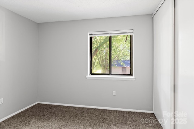2205 Sunderland Rd Unit 129D, Winston Salem, NC 27103 - spare room with carpet and baseboards