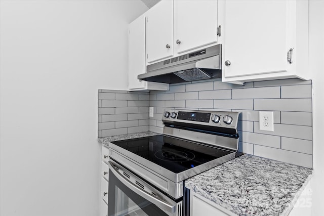 4111 Alexis Ct SW, Concord, NC 28027 - kitchen with stainless steel range with electric stovetop, under cabinet range hood, tasteful backsplash, white cabinets, and light stone countertops