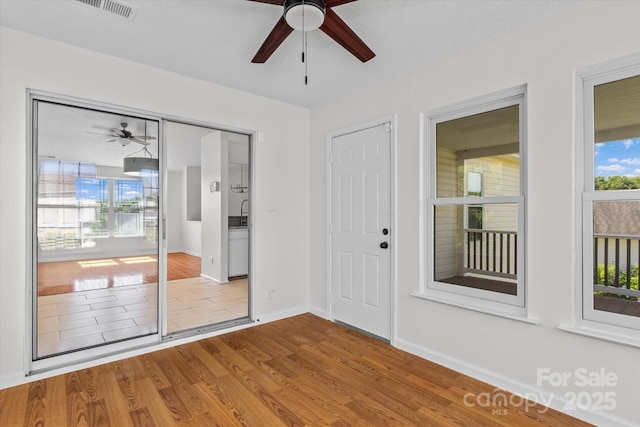 4111 Alexis Ct SW, Concord, NC 28027 - empty room with ceiling fan and wood finished floors