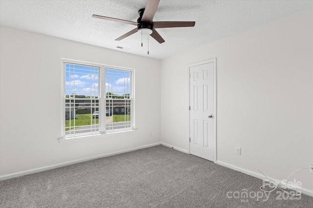 4111 Alexis Ct SW, Concord, NC 28027 - spare room featuring carpet, ceiling fan, and a textured ceiling