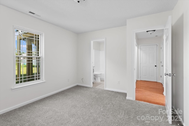 4111 Alexis Ct SW, Concord, NC 28027 - unfurnished bedroom with carpet and ensuite bathroom