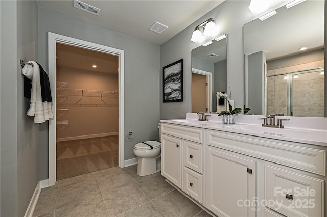 124 Kristin View Ln Unit Townhome A, Troutman, NC 28166 - full bath featuring double vanity, a stall shower, a spacious closet, and tile patterned floors