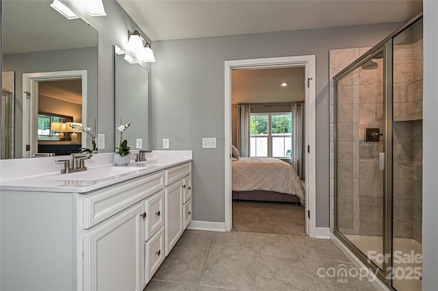 124 Kristin View Ln Unit Townhome A, Troutman, NC 28166 - ensuite bathroom with double vanity, a shower stall, and tile patterned flooring