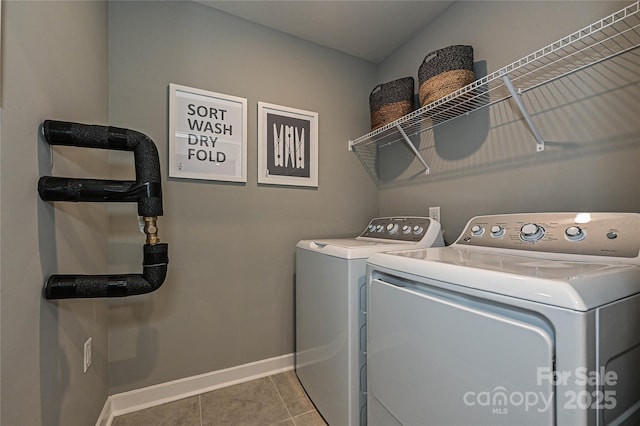 124 Kristin View Ln Unit Townhome A, Troutman, NC 28166 - washroom with washing machine and clothes dryer and tile patterned floors
