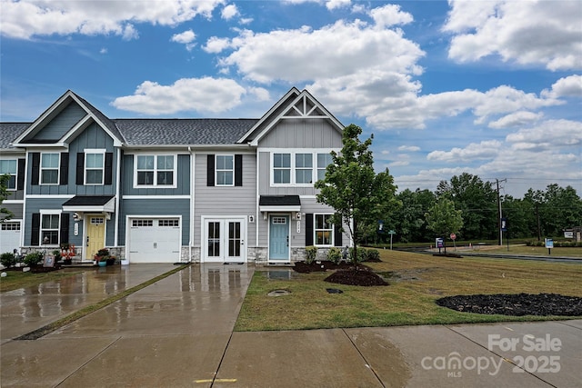 124 Kristin View Ln Unit Townhome A, Troutman, NC 28166 - view of front of property featuring board and batten siding, an attached garage, french doors, and driveway