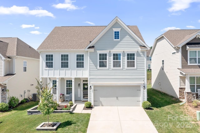 3038 Burnello Ct, Iron Station, NC 28080 - traditional home with driveway, an attached garage, a front yard, covered porch, and a shingled roof