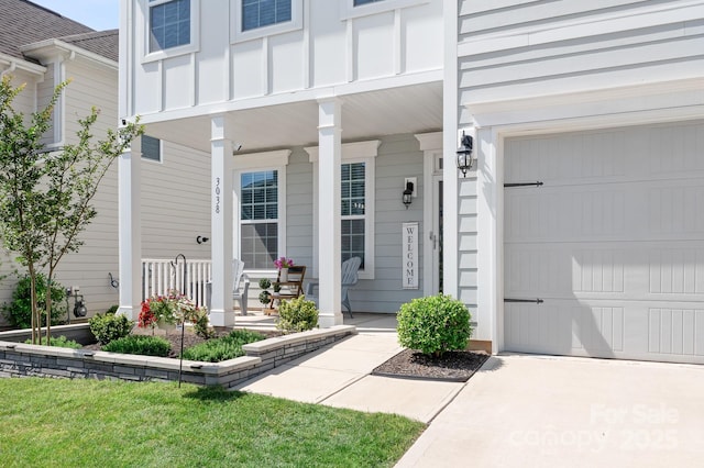 3038 Burnello Ct, Iron Station, NC 28080 - property entrance featuring a porch, a garage, and concrete driveway