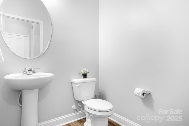3038 Burnello Ct, Iron Station, NC 28080 - bathroom featuring wood finished floors and toilet
