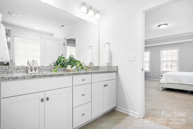 3038 Burnello Ct, Iron Station, NC 28080 - ensuite bathroom with double vanity and tile patterned floors