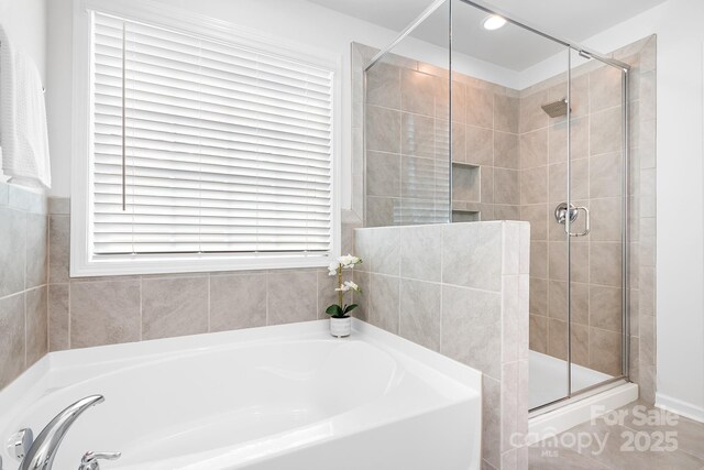 3038 Burnello Ct, Iron Station, NC 28080 - full bathroom featuring a garden tub, a stall shower, plenty of natural light, recessed lighting, and tile patterned floors