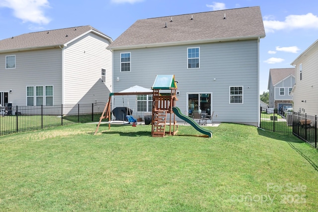 3038 Burnello Ct, Iron Station, NC 28080 - rear view of property with a playground and a fenced backyard