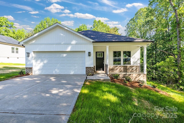 5175 Grand Canyon Rd, Concord, NC 28027 - ranch-style house featuring a porch, concrete driveway, an attached garage, roof with shingles, and brick siding
