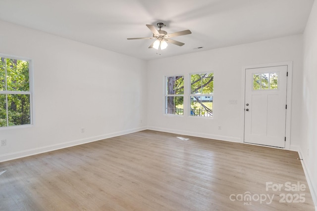 5175 Grand Canyon Rd, Concord, NC 28027 - unfurnished room featuring healthy amount of natural light, wood finished floors, and ceiling fan