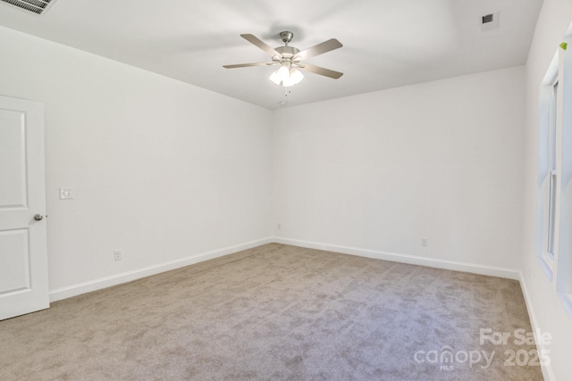 5175 Grand Canyon Rd, Concord, NC 28027 - empty room featuring light colored carpet, ceiling fan, and baseboards