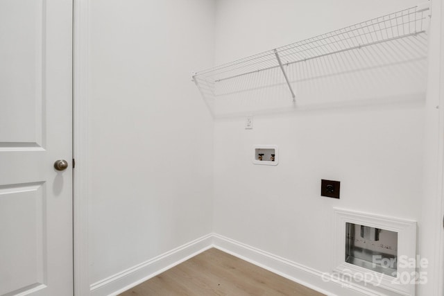 5175 Grand Canyon Rd, Concord, NC 28027 - laundry area featuring hookup for an electric dryer, washer hookup, baseboards, and wood finished floors