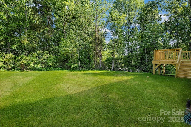 5175 Grand Canyon Rd, Concord, NC 28027 - view of grassy yard featuring a wooden deck and stairs