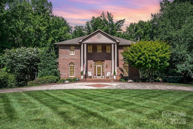 408 Johnsfield Rd, Shelby, NC 28150 - greek revival house featuring a front lawn, brick siding, and concrete driveway
