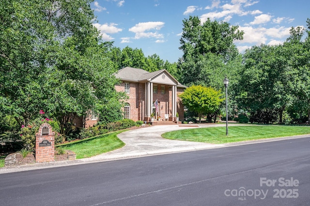 408 Johnsfield Rd, Shelby, NC 28150 - greek revival house with a front yard, brick siding, and driveway